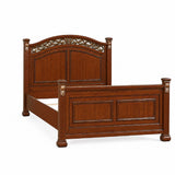 Bed With Ornate Carvings And Curved Headboard